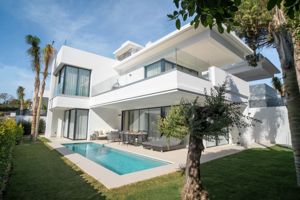 Modern luxury villa in Rio Verde, Marbella, showcasing sleek design, private pool, and prime location near the beach - presented by MDR Luxury Homes